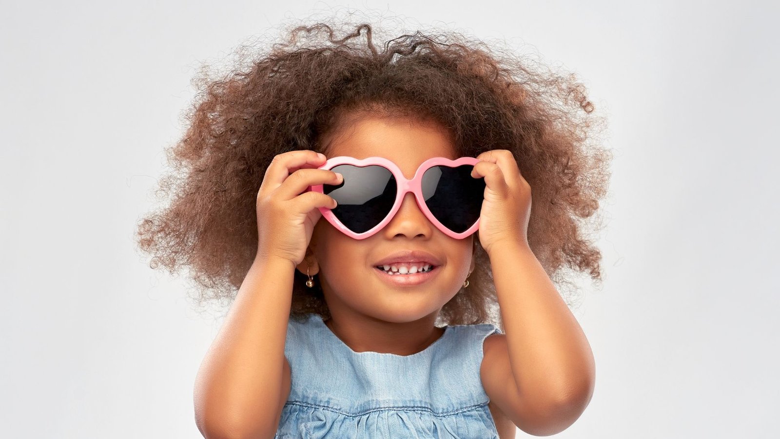 Little Girl Wearing Heart Shaped Sunglasses
